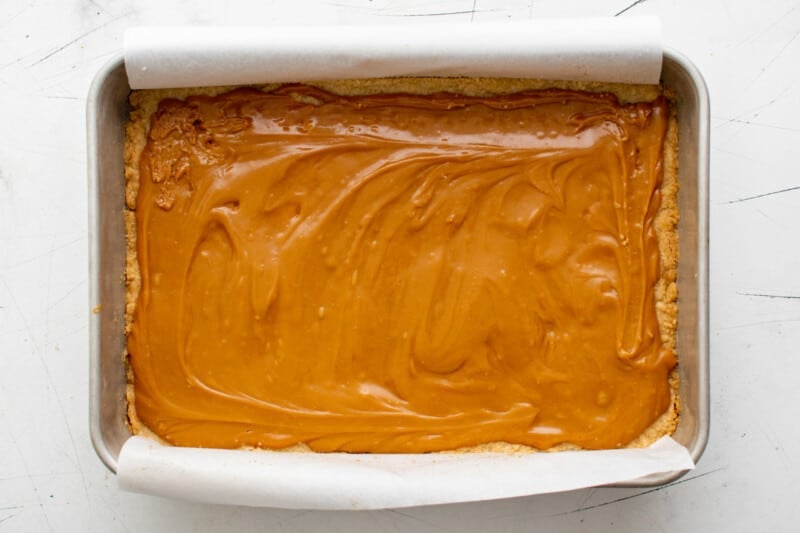 caramel spread over crust in a baking pan.