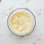 creamed butter, sugar, and egg in a glass bowl.