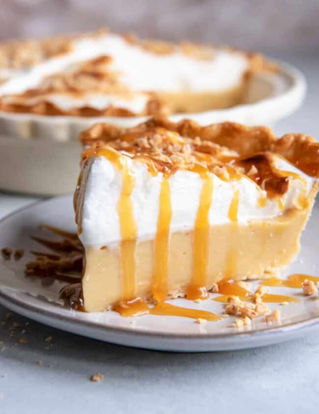 a slice of homemade butterscotch pie on a plate