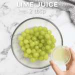 grapes in a bowl of water with lime juice.