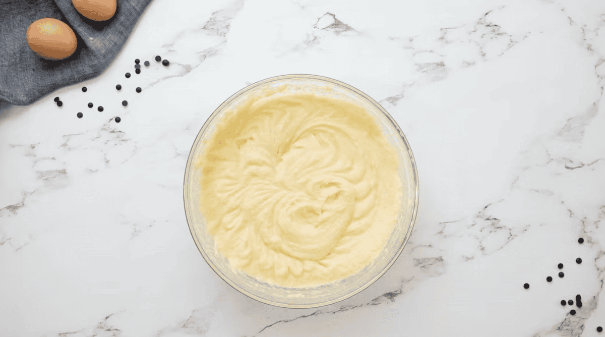 beaten eggs, sugar, and butter in a glass bowl.