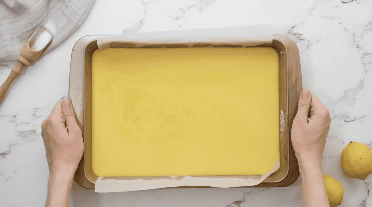 unbaked lemon bars in a baking pan.