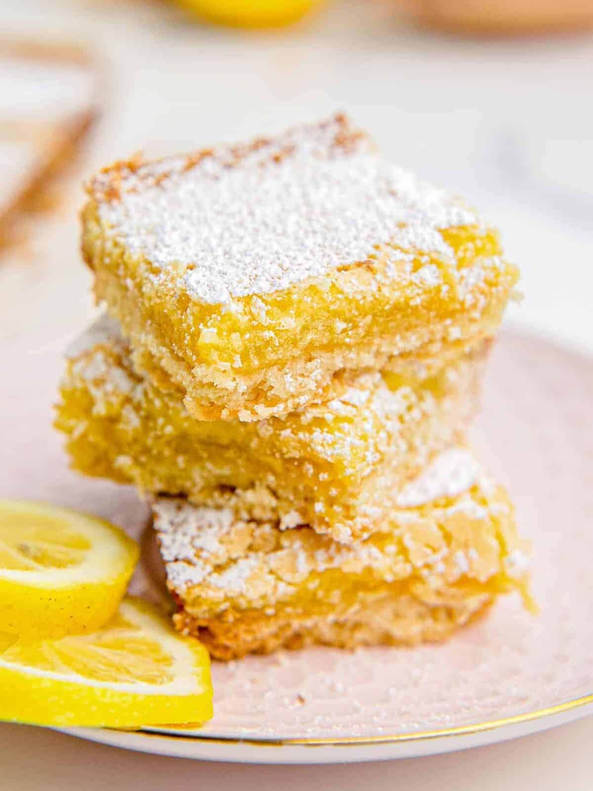 stacked lemon bars with powdered sugar