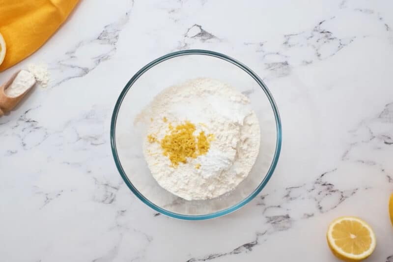 flour, salt, baking soda, and lemon zest in a glass bowl.
