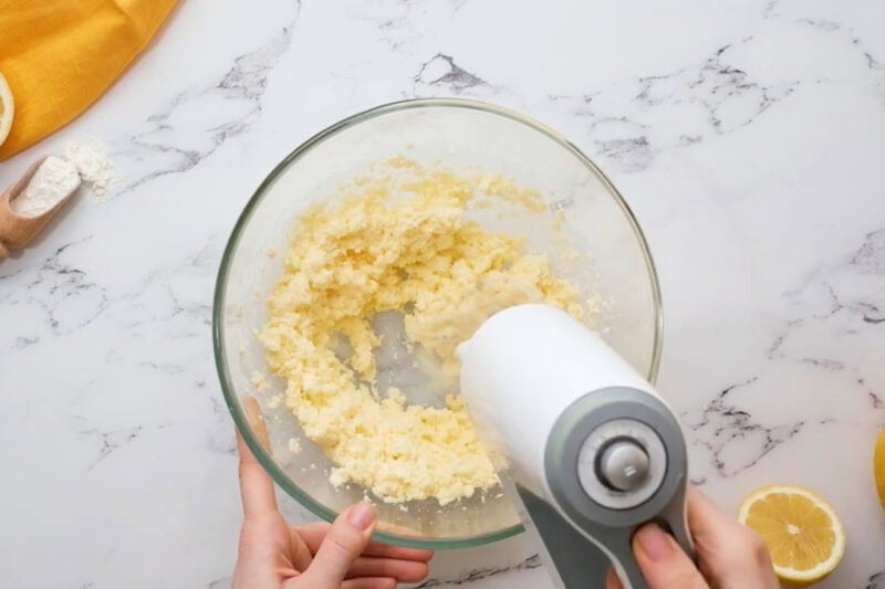 creaming butter and sugar in a glass bowl.