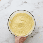 lemon cupcake batter in a glass bowl.