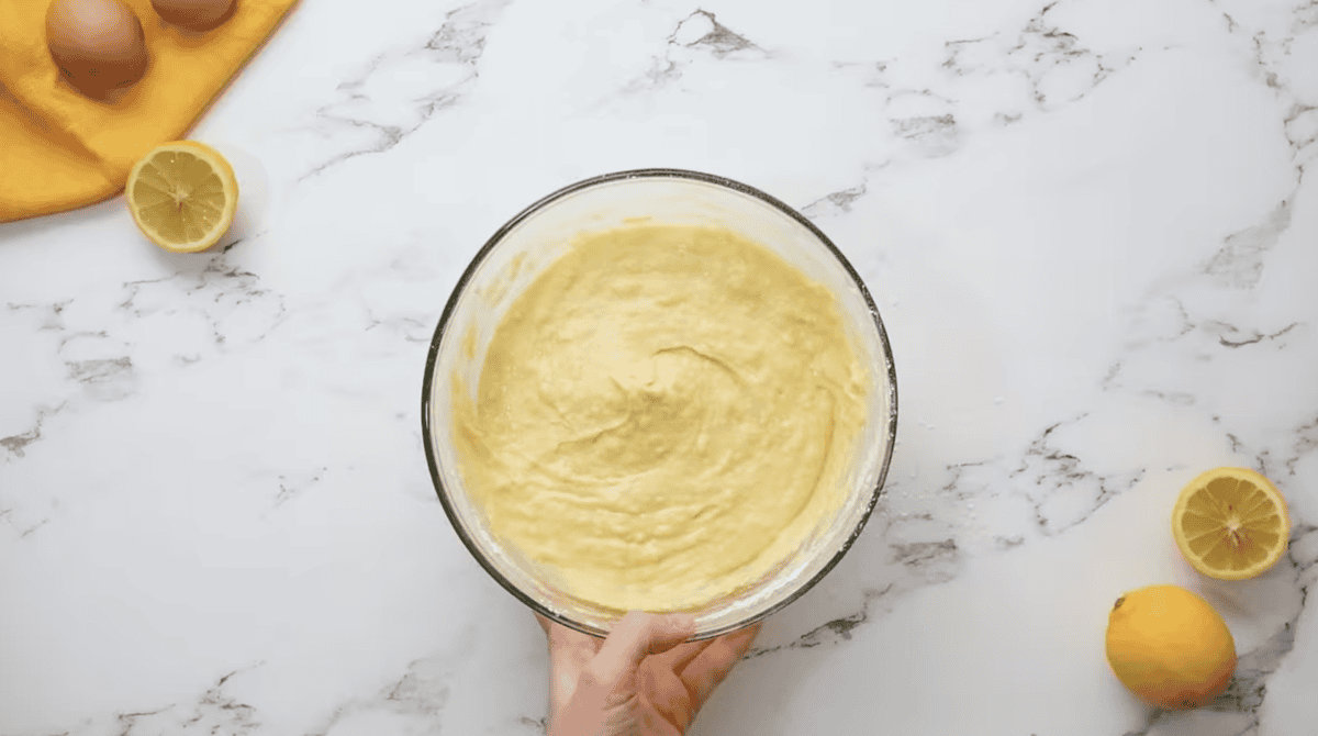 lemon cupcake batter in a glass bowl.