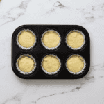 lemon cupcake batter in a cupcake tin.