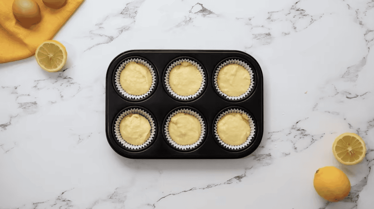 lemon cupcake batter in a cupcake tin.