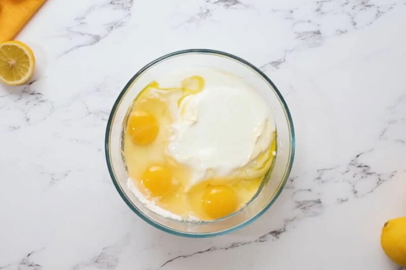 ingredients for lemon cupcakes in a glass bowl.