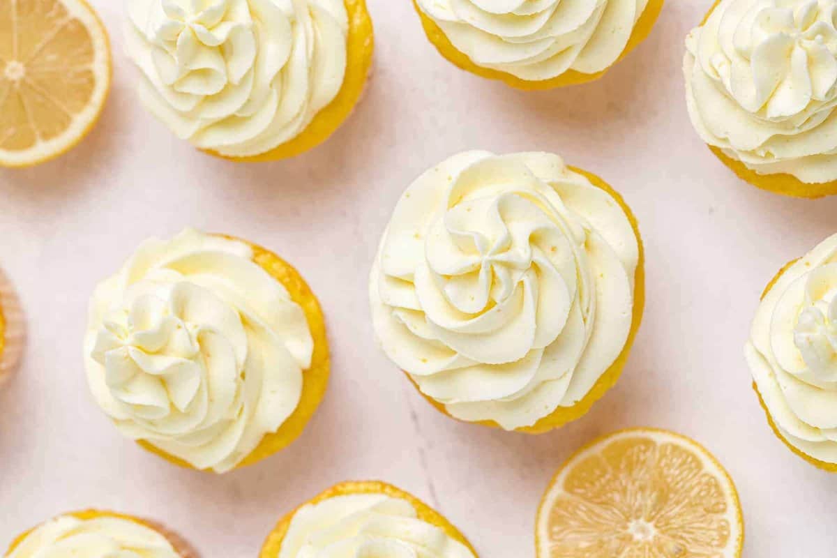 overhead image of lemon cupcakes with lemon frosting