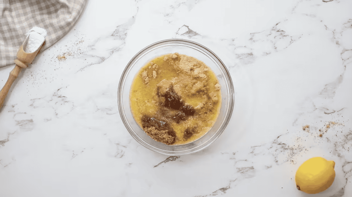 graham crackers, brown sugar, and melted butter in a glass bowl.