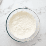 lemony whipped cream cheese in a glass bowl.