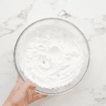 whipped cream in a glass bowl.