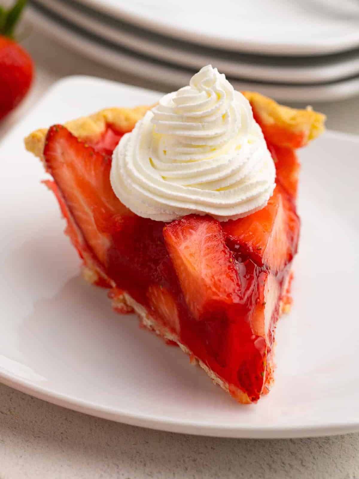 slice of strawberry jello pie with whipped cream
