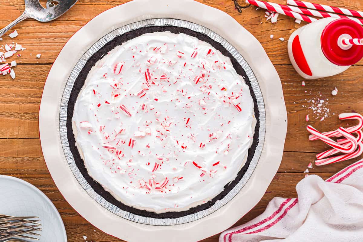 peppermint pie topped with whipped cream and crushed peppermints.