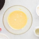 white chocolate ganache in a glass bowl.