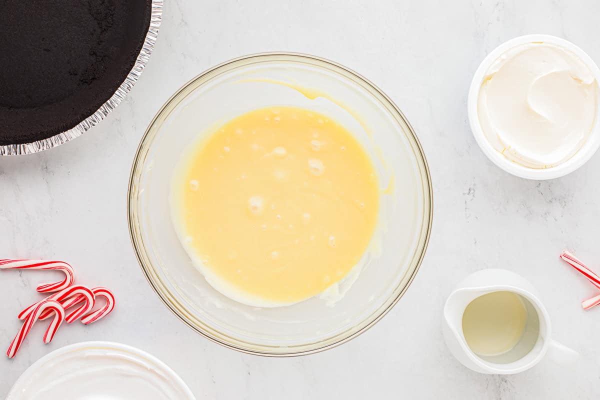 white chocolate ganache in a glass bowl.