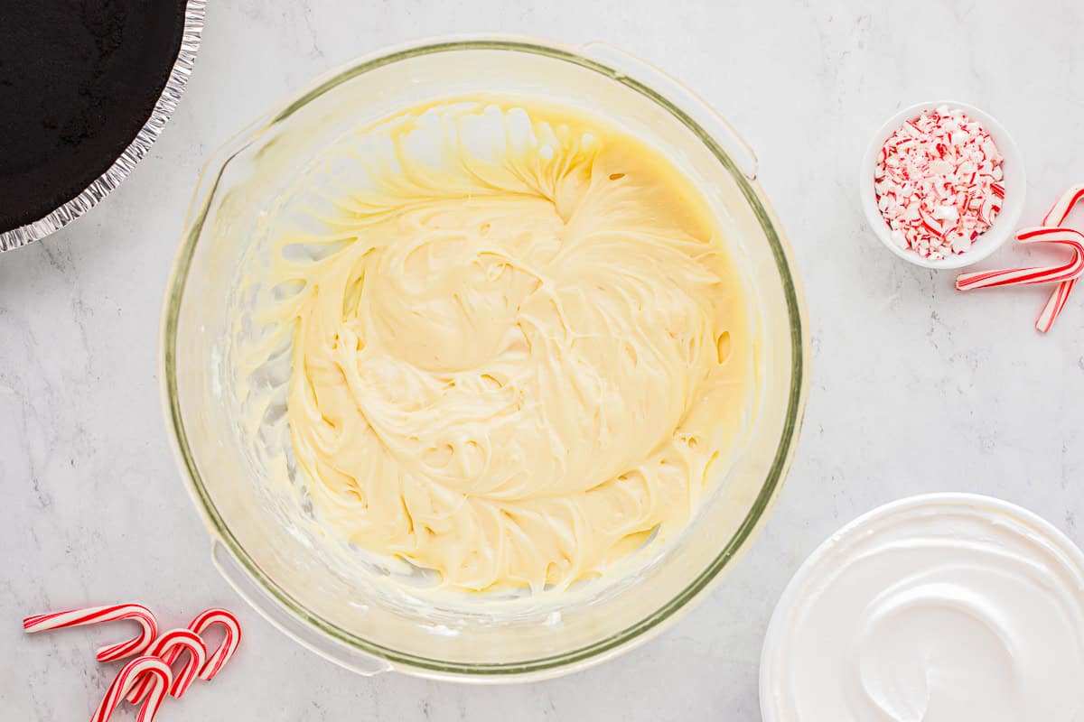 whipped white chocolate cream cheese filling in a glass bowl.