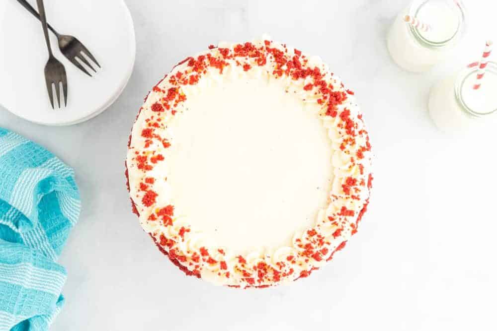 overhead view of red velvet cake on a cake stand.