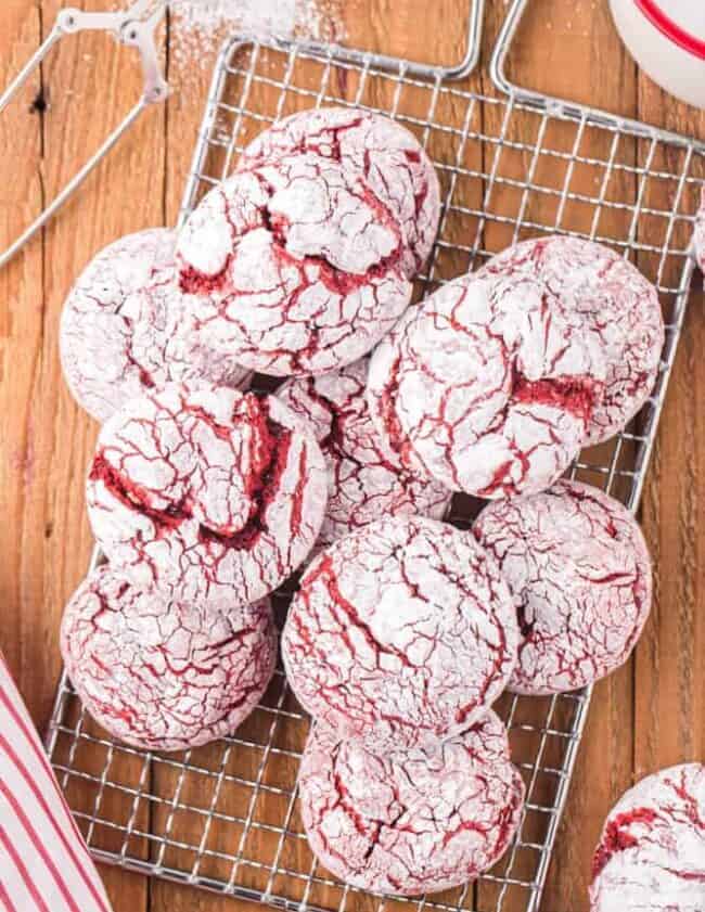 red velvet crinkle cookies on a cooling tray