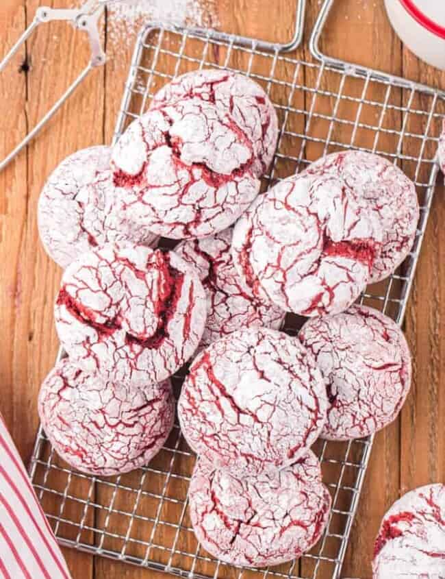 red velvet crinkle cookies on a cooling tray