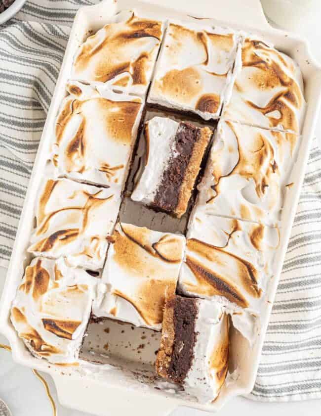 a rectangular dish with a brownie and marshmallows.