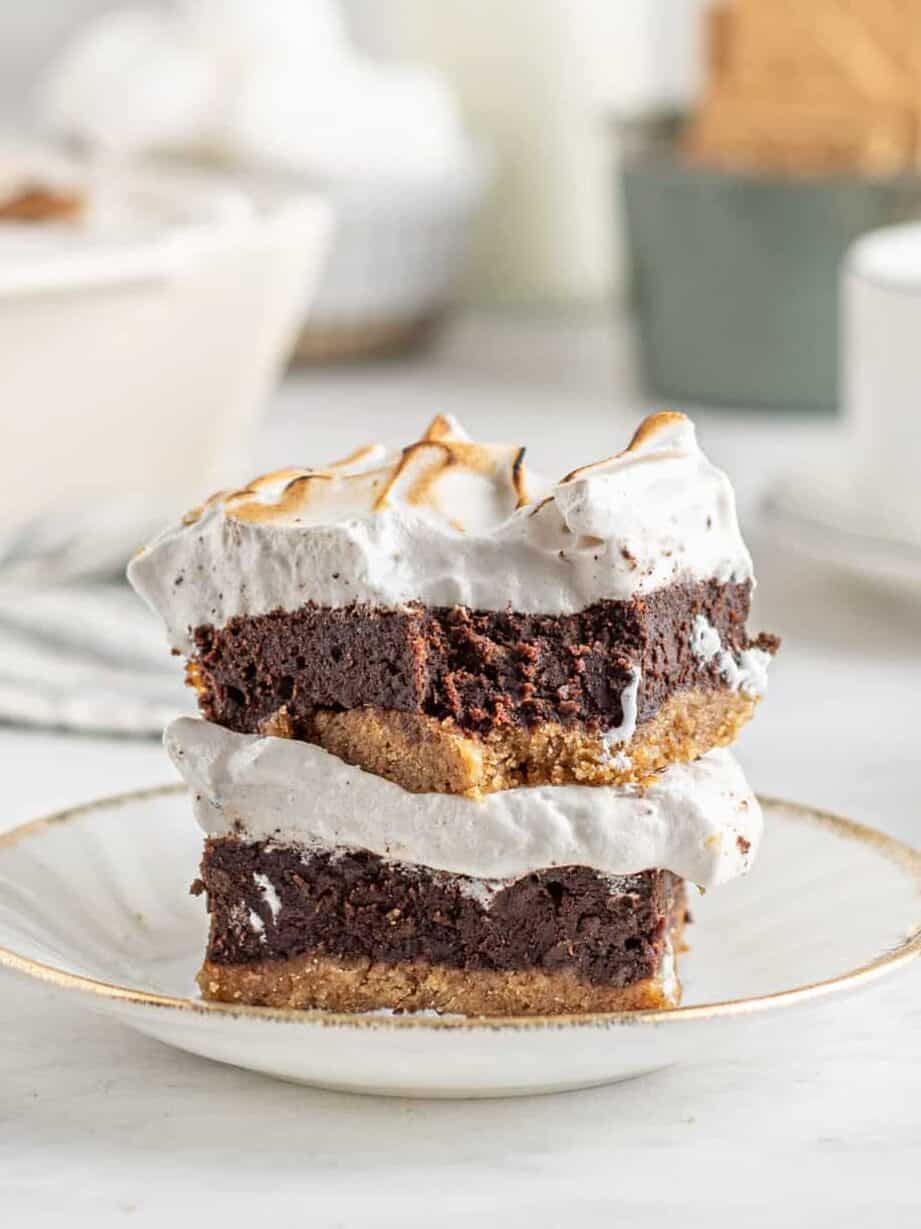 layered brownies with graham cracker crust and meringue topping