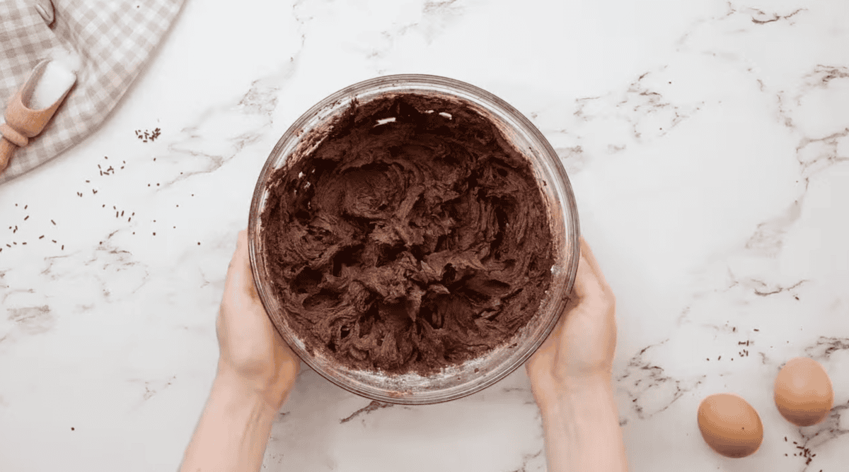 chocolate buttercream frosting in a glass bowl.