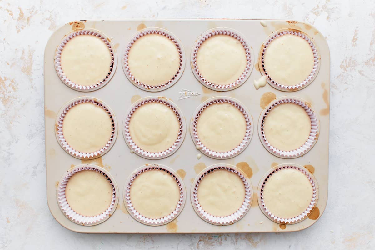 Cupcake tin filled with batter.