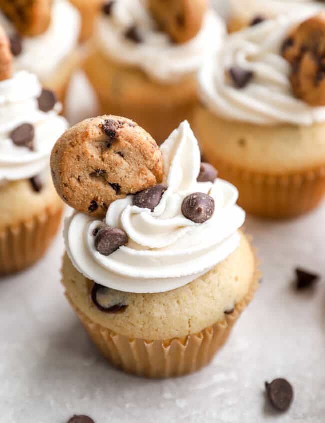 Cupcakes with chocolate chips and topped with mini cookies.