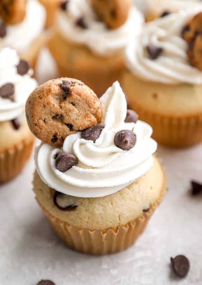 Cupcakes with chocolate chips and topped with mini cookies.