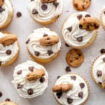 Overhead view of cupcakes lined up, sprinkled with chocolate chips.