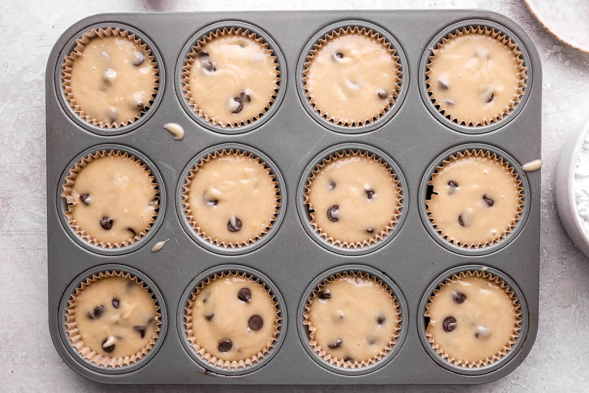 Cupcake tin filled with cupcake batter.