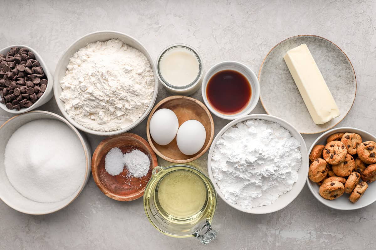 Ingredients for chocolate chip cupcakes arranged in dishes.