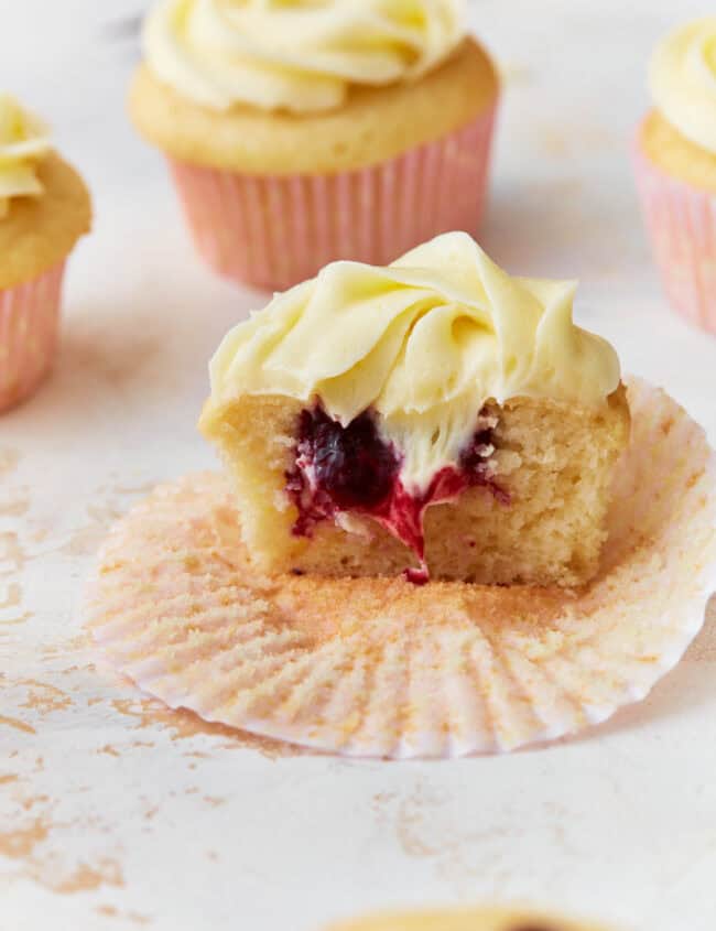 berry filled cupcake with vanilla frosting