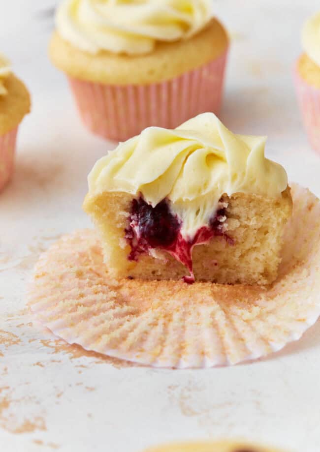 berry filled cupcake with vanilla frosting