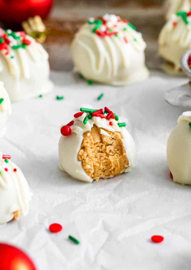 a partially eaten white chocolate peanut butter ball.