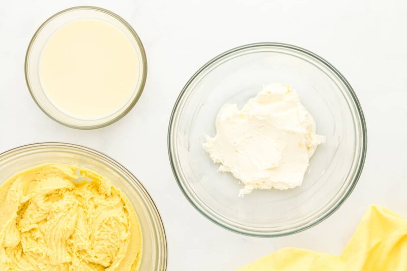 beaten cream cheese in a glass bowl.