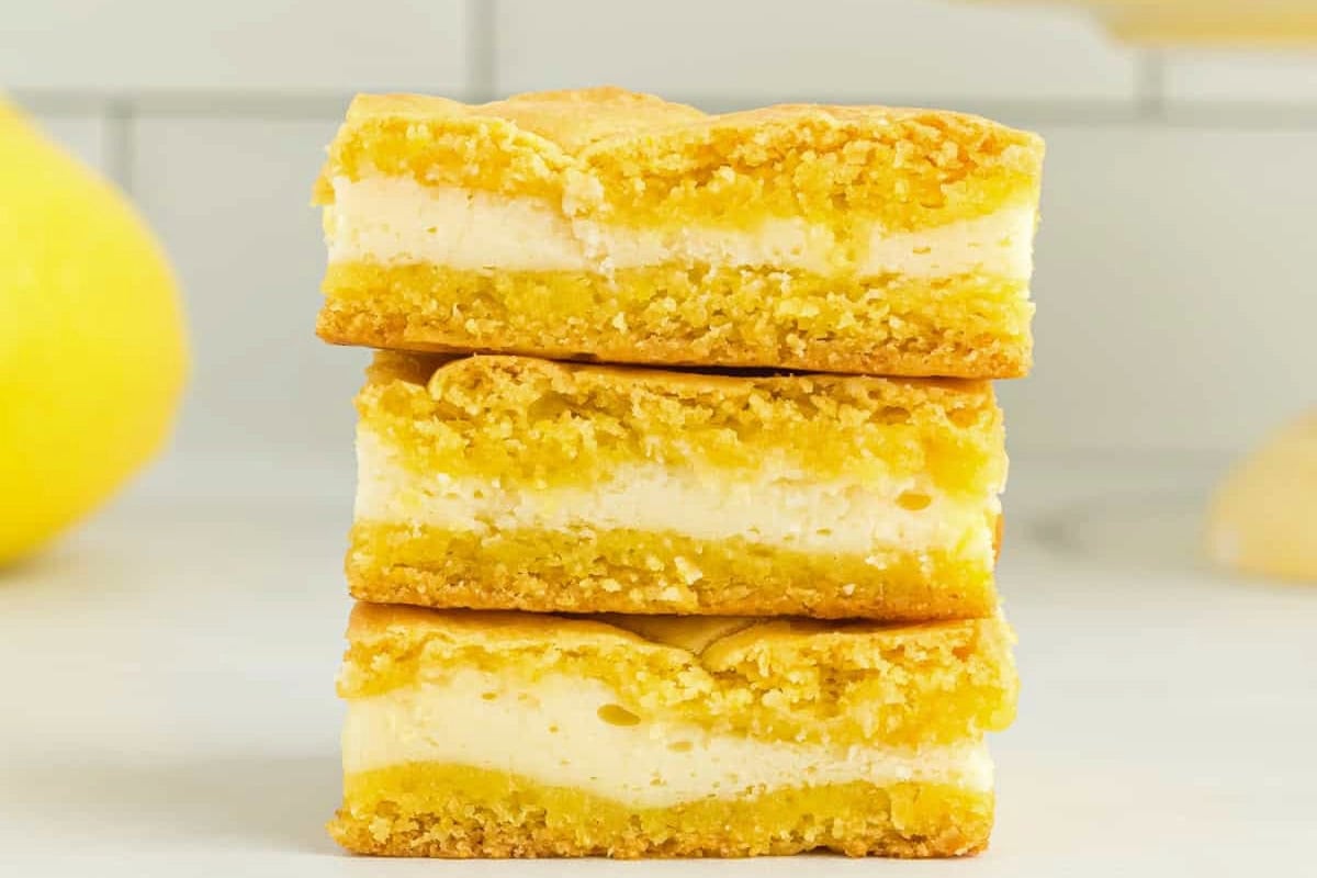 closeup of a stack of three lemon cake bars.