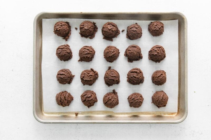 shaped thin mint truffles on a baking sheet.