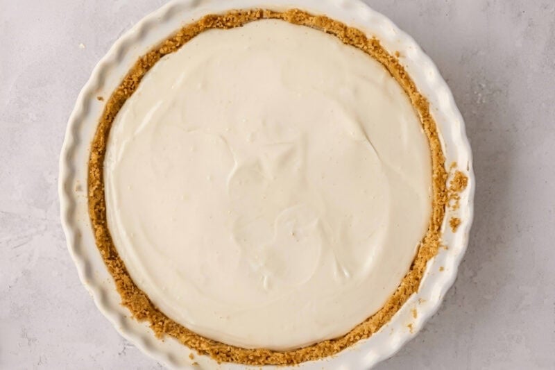key lime pie in a pie dish before baking.
