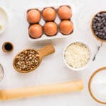 measured ingredients for german chocolate pie in individual bowls.