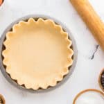 crimped pie crust in a pie pan.