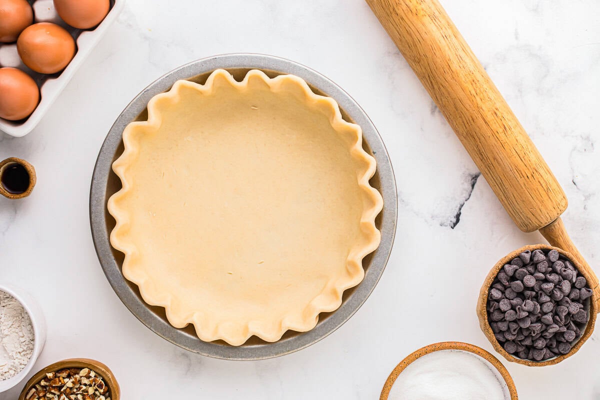 crimped pie crust in a pie pan.