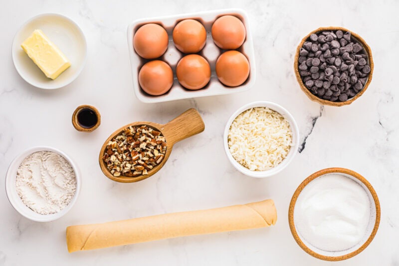 measured ingredients for german chocolate pie in individual bowls.