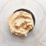 creamed butter and sugars in a glass bowl.