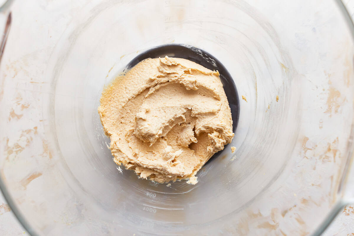 creamed butter and sugars in a glass bowl.