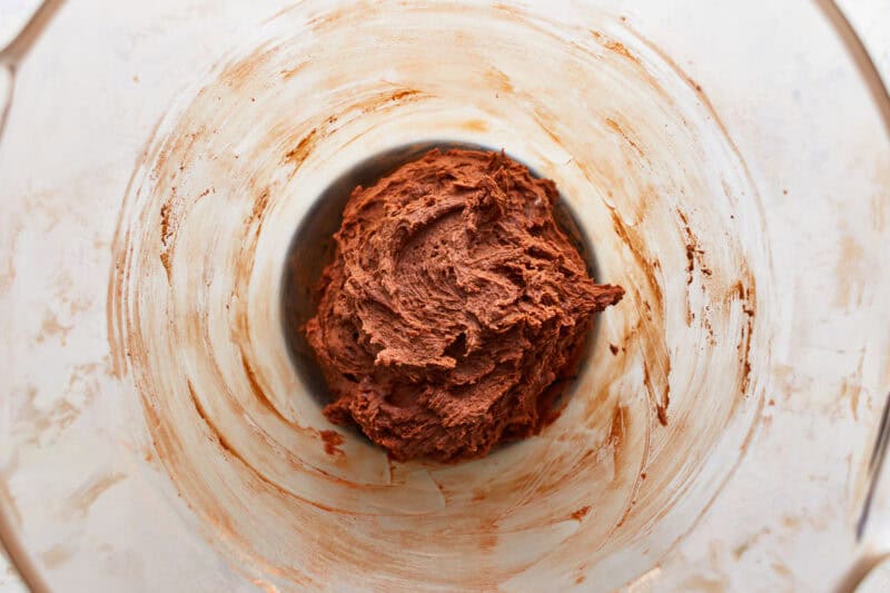 sticky chocolate cookie dough in a glass bowl.