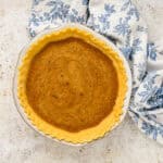 vinegar pie filling poured into a baked pie crust.